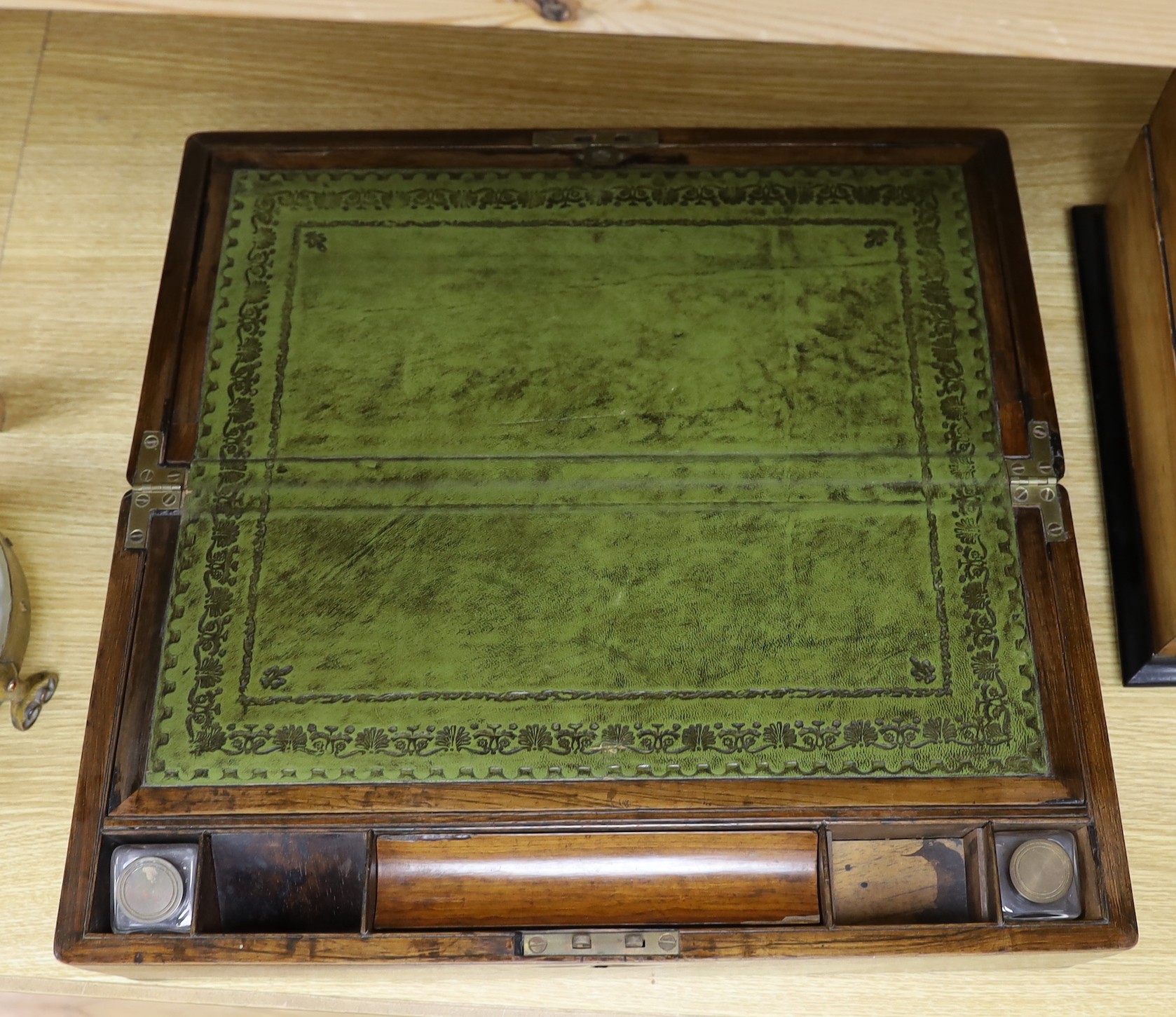 A Victorian brass bound rosewood writing slope and a Victorian walnut inkstand stationery rack, largest 50cm wide